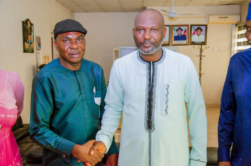 Mr. Osho Stephen Toyin, Zonal Coordinator, NACETEM South-South (left), and Hon. Engr. Munalayefa Edwin Gibson, Commissioner, Bayelsa State Ministry of Communications, Science and Technology, during a handshake symbolizing partnership.